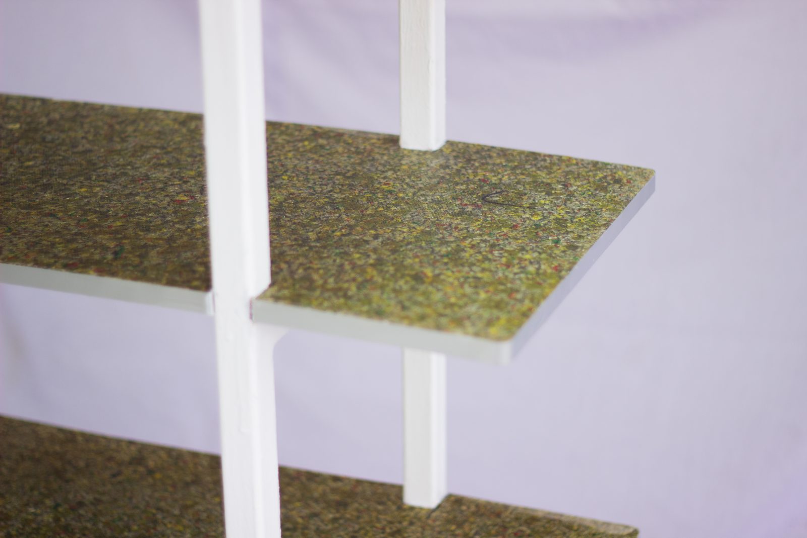 RePro recycled composite board surface showing mixed material fragments